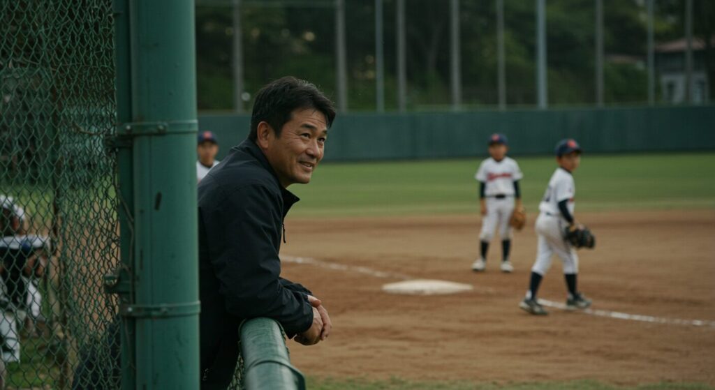 少年野球の試合を見守る父親の温かいサポートのイメージ